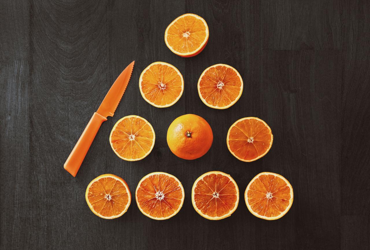 Sliced Orange Fruit With Knife